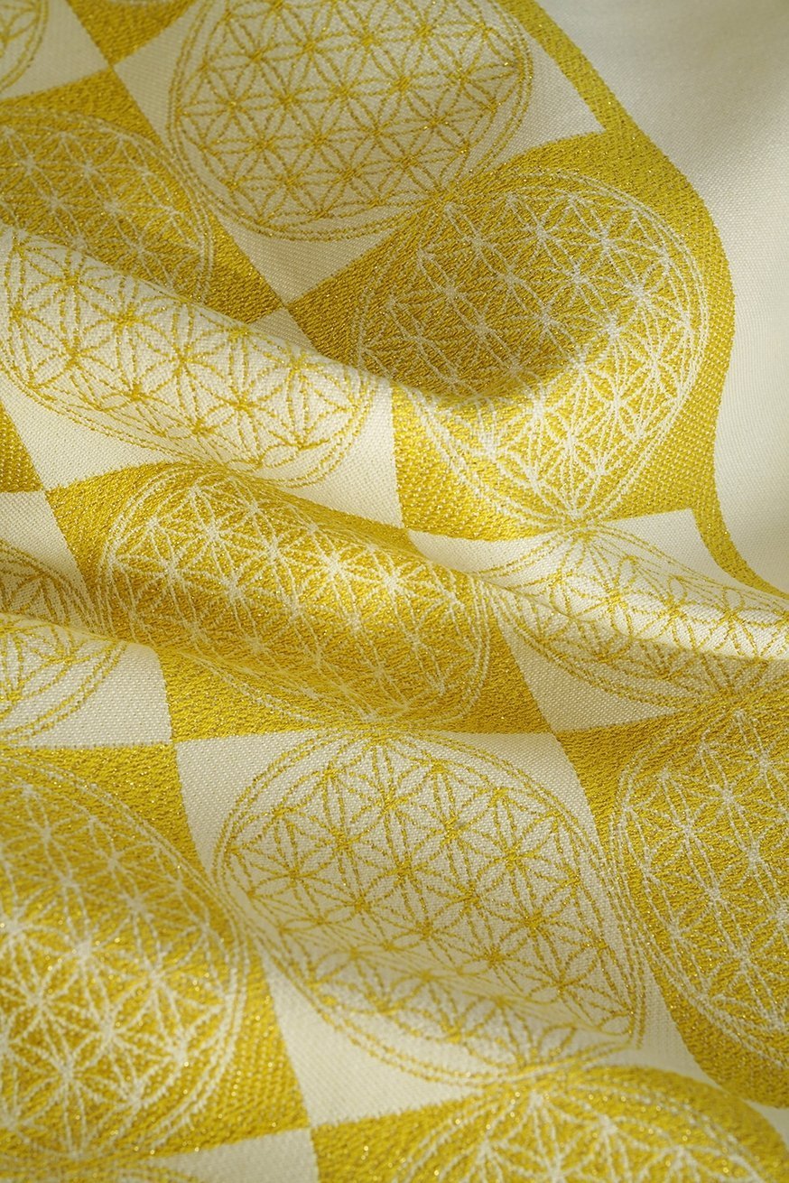 KOKADI Portabebé TaiTai Flor de la vida dorada.